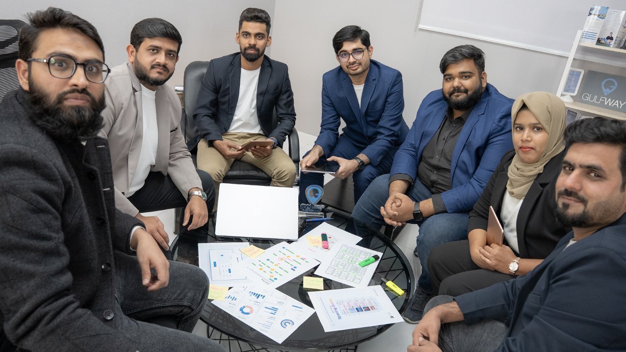 Collaborative Gulf Way Auto Services Dubai digital marketing and IT team strategizing online growth and software innovation in the UAE.