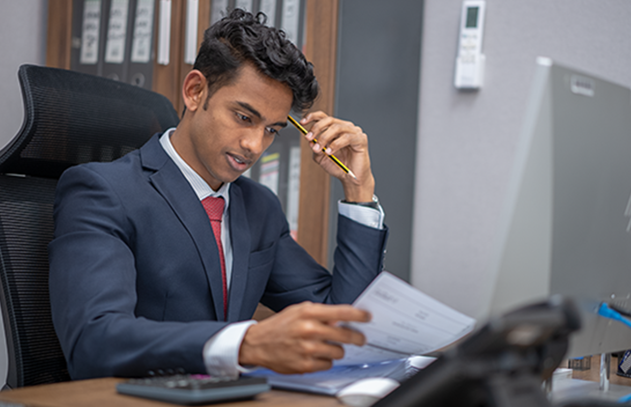 Gulf Way Auto Services finance professional in office, highlighting expertise in managing financial stability and operations.
