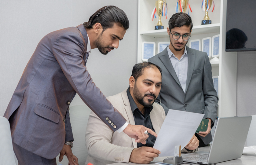 Gulf Way Auto Services PRO team collaborating on documents, ensuring legal compliance and efficient business support.