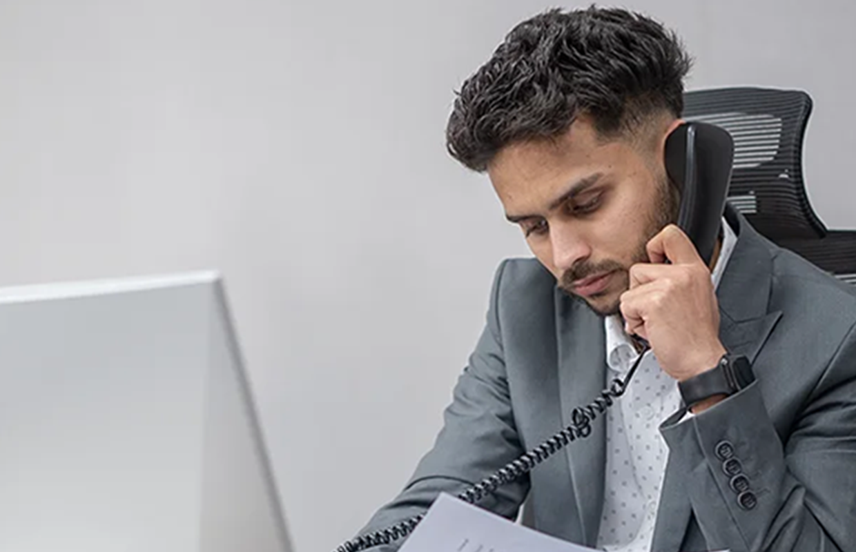 Gulf Way Auto Services accounts team member at desk, symbolizing dedication to accurate financial management and reporting.