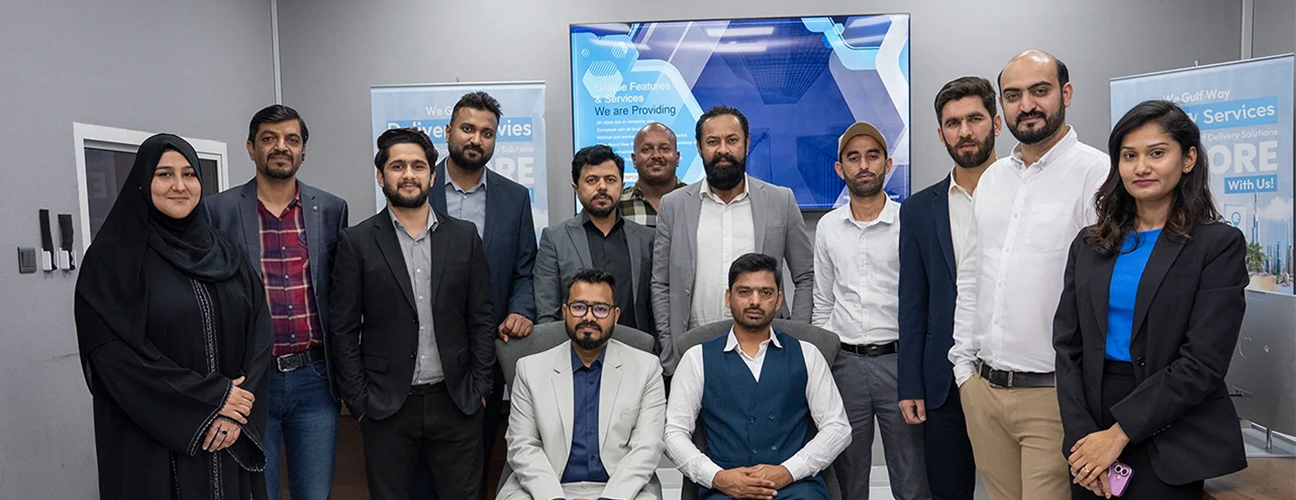 Gulf Way Auto Services' diverse administration team in their office, representing expertise in auto and bike repair management.