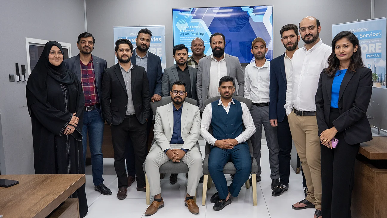 Diverse Gulf Way Auto Services admin team in office, driving seamless operations and top-notch customer service for auto repairs.
